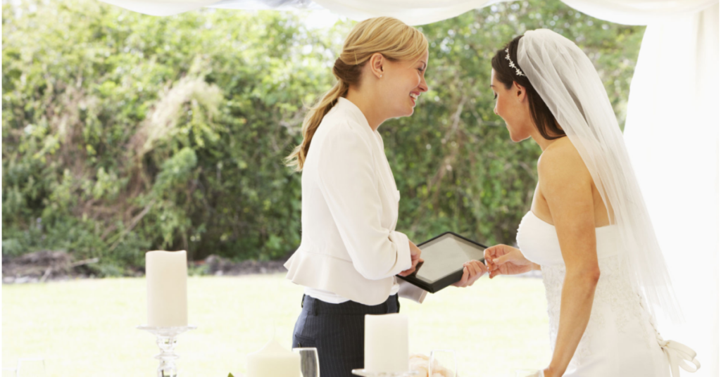 Bride with her wedding planner looking at last minute wedding checklist