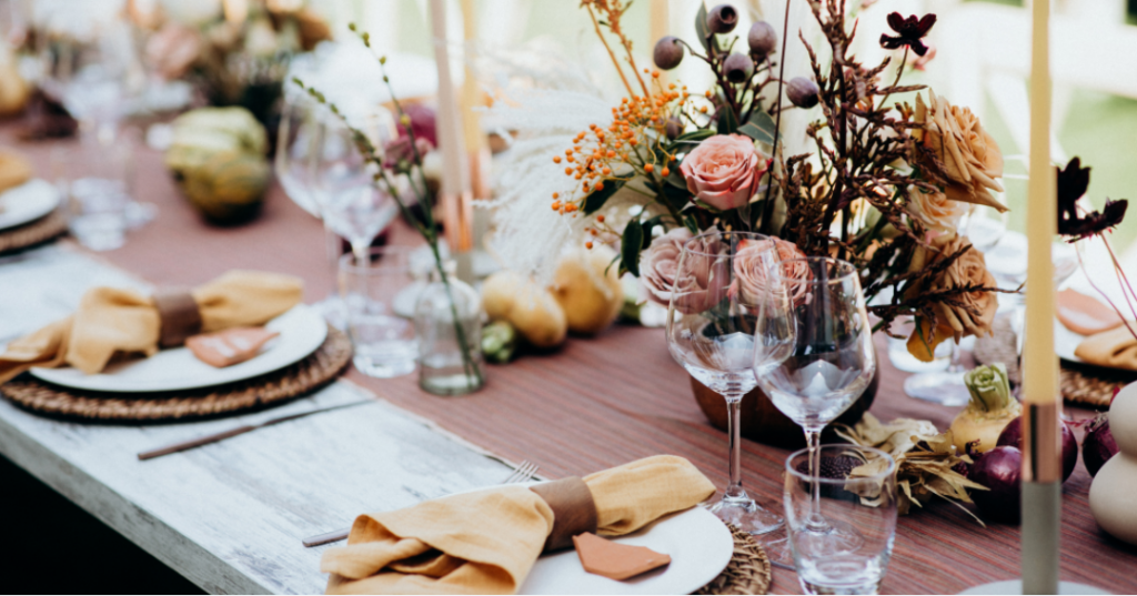 Cozy terracotta and romantic dusty rose wedding table setup for an August event